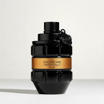 Black perfume bottle with orange label on a white background